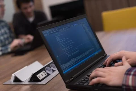 Programmer writing programming code Stockfoto's