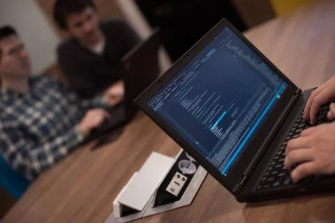 Programmer writing programming code Stockfoto's