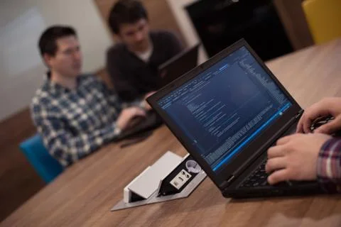 Programmer writing programming code Stockfoto's