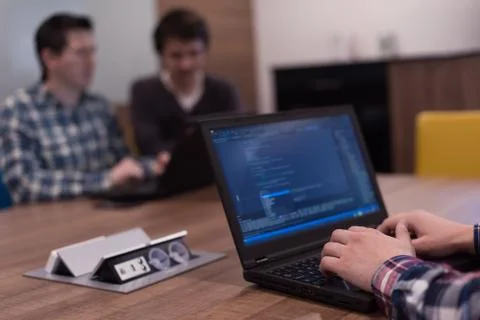 Programmer writing programming code Stockfoto's