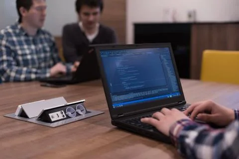 Programmer writing programming code Stock Photos