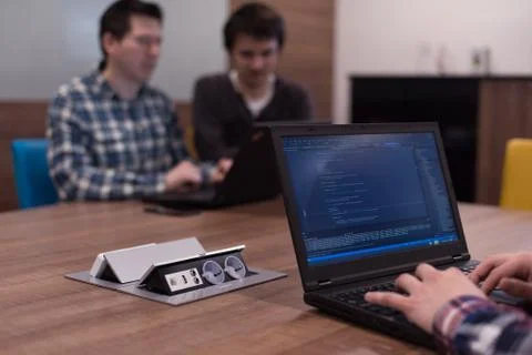 Programmer writing programming code Stockfoto's