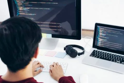 Programmers and developer teams are coding and developing software 스톡 사진