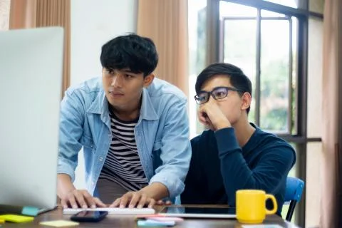 Programmers and developer teams are coding and developing software Foto stock