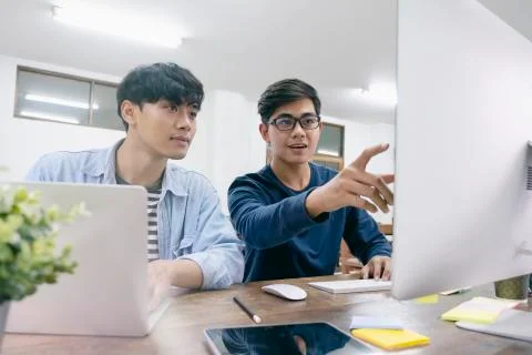 Programmers and developer teams are coding and developing software Foto stock