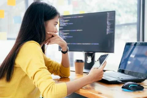 Programmers and developer teams are coding and developing software 库存照片