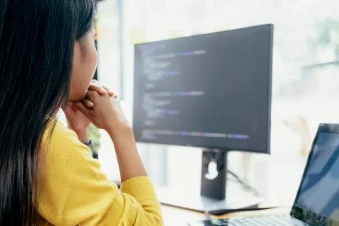Programmers and developer teams are coding and developing software Stock Photos