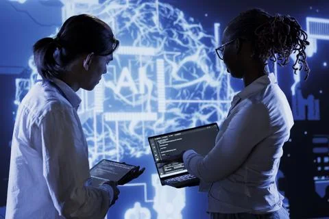 Programmers brainstorming ways to use AI 写真素材