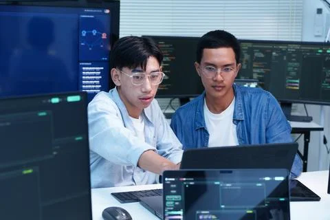 Programmers Collaborating on AI Software Development Stock Photos
