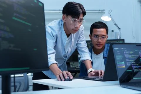 Programmers Collaborating on Digital Code Development 库存照片