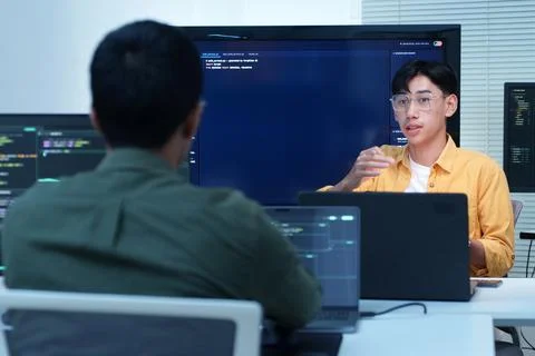 Programmers Collaborating on Software Development and AI Stock Photos