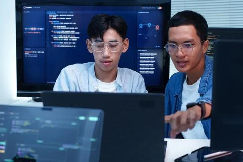 Programmers Collaborating on Software Development and AI Code Foto stock
