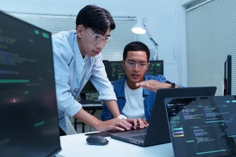 Programmers Collaborating on Software Development and AI Code Foto stock