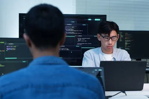 Programmers Collaborating on Software Development and AI Code Foto stock