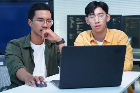 Programmers Collaborating on Software Development with Laptop 写真素材