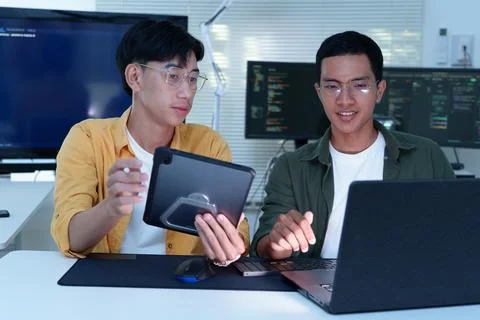 Programmers Collaborating on Software Development Stock Photos