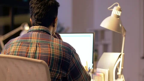 Programmers with computers working late at office Stock Footage 88048868