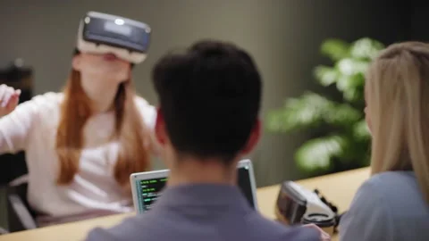 Programmers conducting VR software test in office Stock Footage 142062939