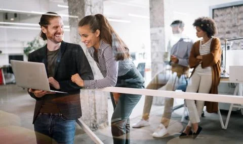 Programmers cooperating brainstorming at information technology company Stock Photos