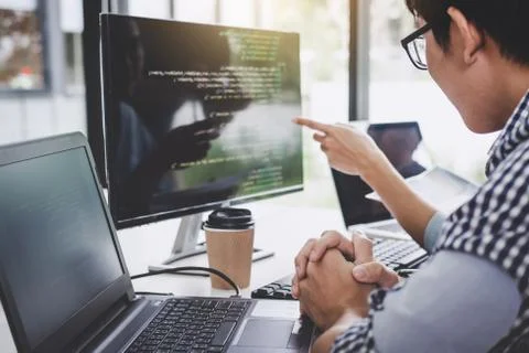 Programmers cooperating at Developing programming and website working in a so Foto stock