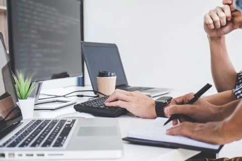 Programmers cooperating at Developing programming and website working in a so Foto stock