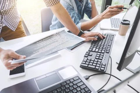 Programmers cooperating at Developing programming and website working in a so Foto stock