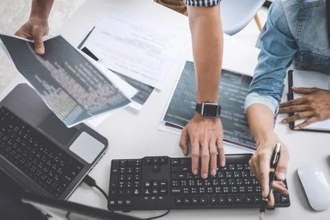 Programmers cooperating at Developing programming and website working in a so Foto stock