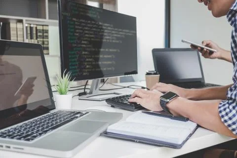 Programmers cooperating at Developing programming and website working in a so Foto stock