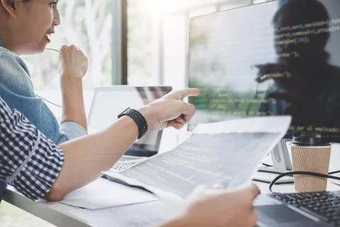 Programmers cooperating at Developing programming and website working in a so Foto stock