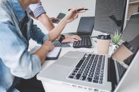Programmers cooperating at Developing programming and website working in a so Foto stock