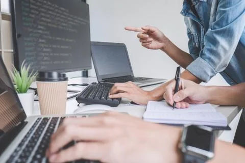 Programmers cooperating at Developing programming and website working in a so Foto stock
