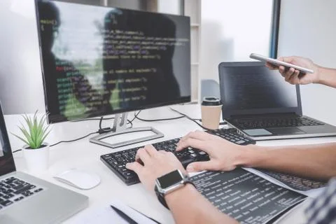 Programmers cooperating at Developing programming and website working in a so Foto stock