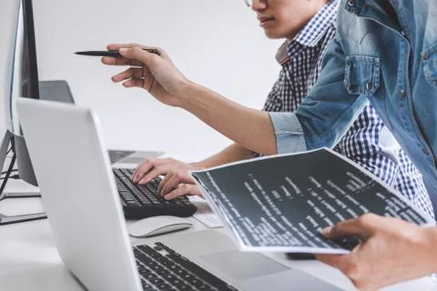 Programmers cooperating at Developing programming and website working in a so Foto stock