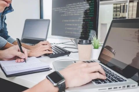Programmers cooperating at Developing programming and website working in a so Foto stock