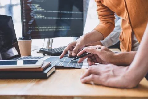 Programmers cooperating at Developing programming and website working in a so Stock-Fotos