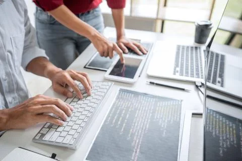 Programmers cooperating at Developing programming and website working in a so Stock-Fotos