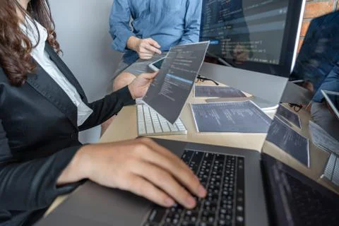 Programmers cooperating at Developing programming and website working in a so Stock-Fotos