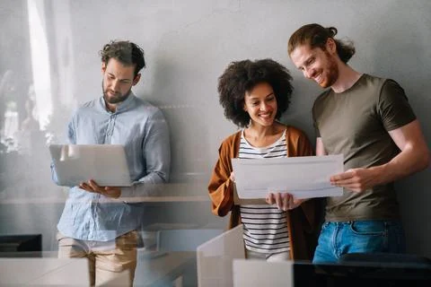 Programmers cooperating at IT company developing apps. People business work Stock Photos