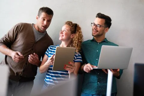 Programmers cooperating at IT company developing apps. Business people Stock Photos
