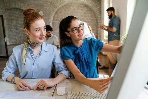 Programmers cooperating at IT company developing apps. Business people tech.. Stock Photos