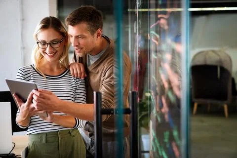 Programmers cooperating at IT company developing apps. Business people tech.. Stock Photos