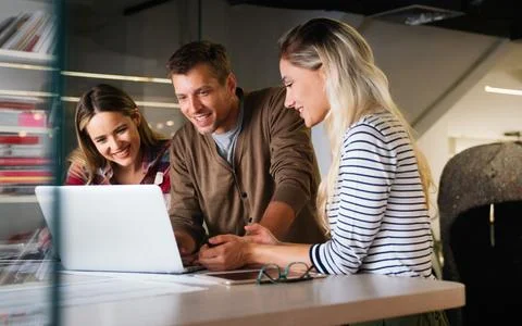 Programmers cooperating at IT company developing apps. Business people tech.. Stock Photos