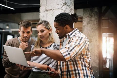 Programmers cooperating at IT company developing apps. People business work.. Stock Photos