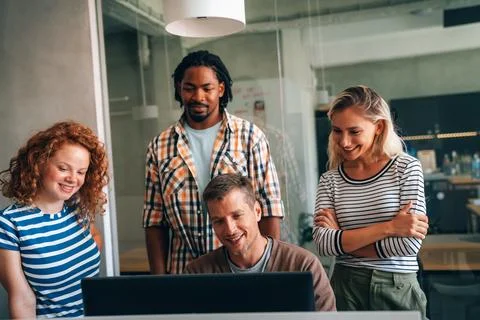 Programmers cooperating at IT company developing apps. People business work.. Stock Photos