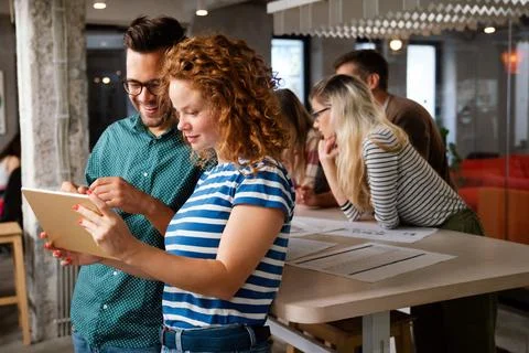 Programmers cooperating at IT company developing apps. People business work.. Stock Photos