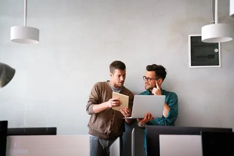 Programmers cooperating at IT company developing apps. People business work.. Stock Photos