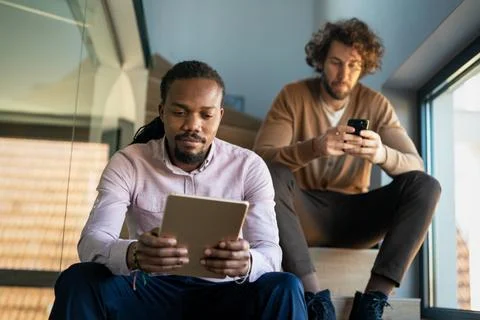 Programmers cooperating at IT company developing apps. People business work Stock Photos