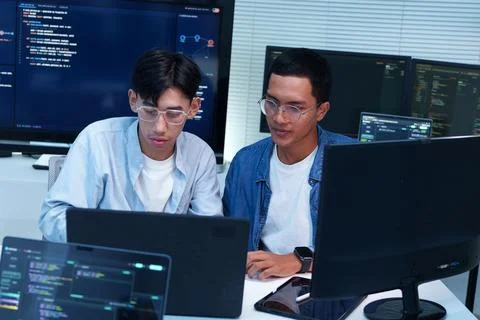Programmers Developing Digital Software and AI Solutions Foto stock