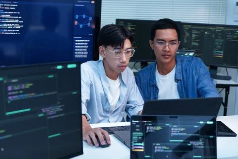 Programmers Developing Digital Software with Code and AI Technology Stock Photos