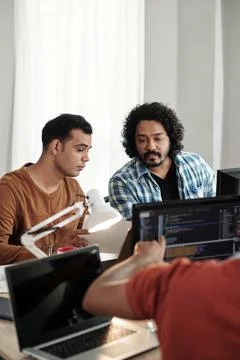 Programmers Discussing New Release Stock Photos
